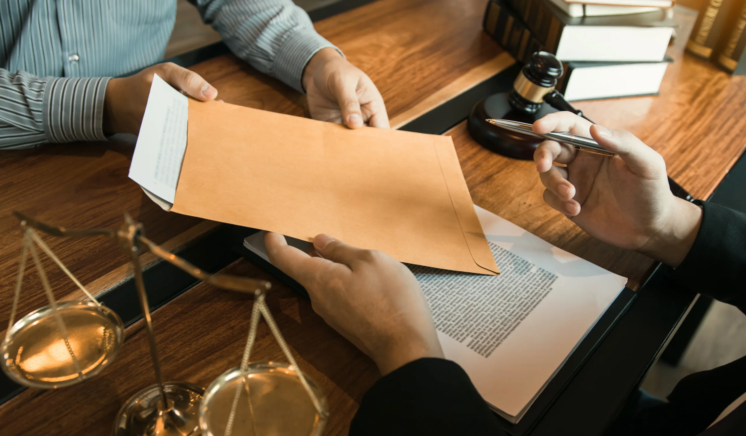 client handing SIR paper work to a security clearance attorney