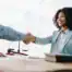 woman shaking hands with a security clearance lawyer