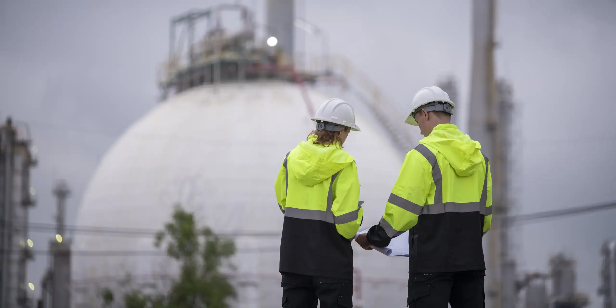 worker-wearing-safety-helmets-and-high-visibility-2025-03-15-22-02-19-utc employees at the department of energy