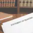 Lawyer holding Statement of Reasons document